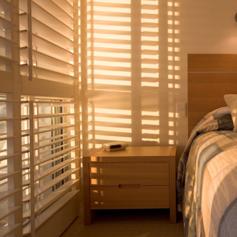 wooden blinds in bedroom