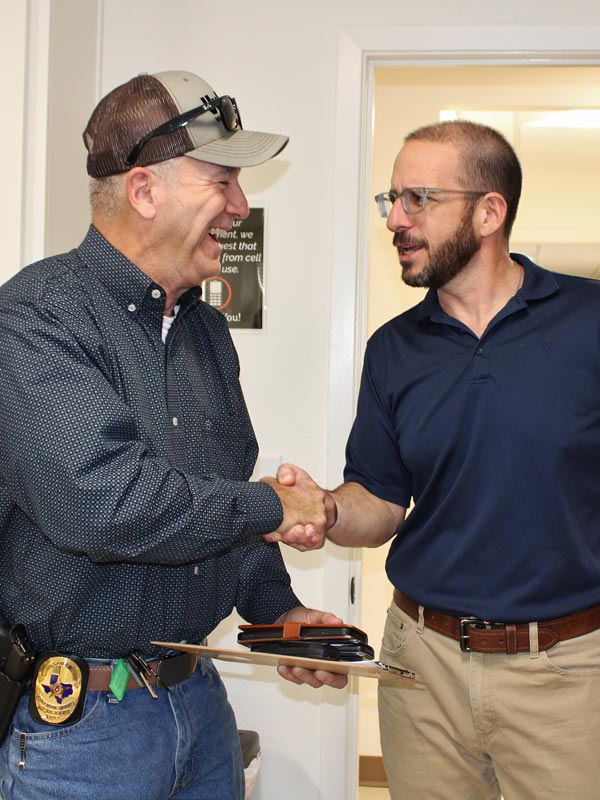 Dr. Acevedo shaking hands with a patient