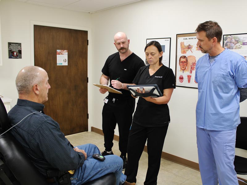 Nurse practioner Amanda Duke with inspire team and patient